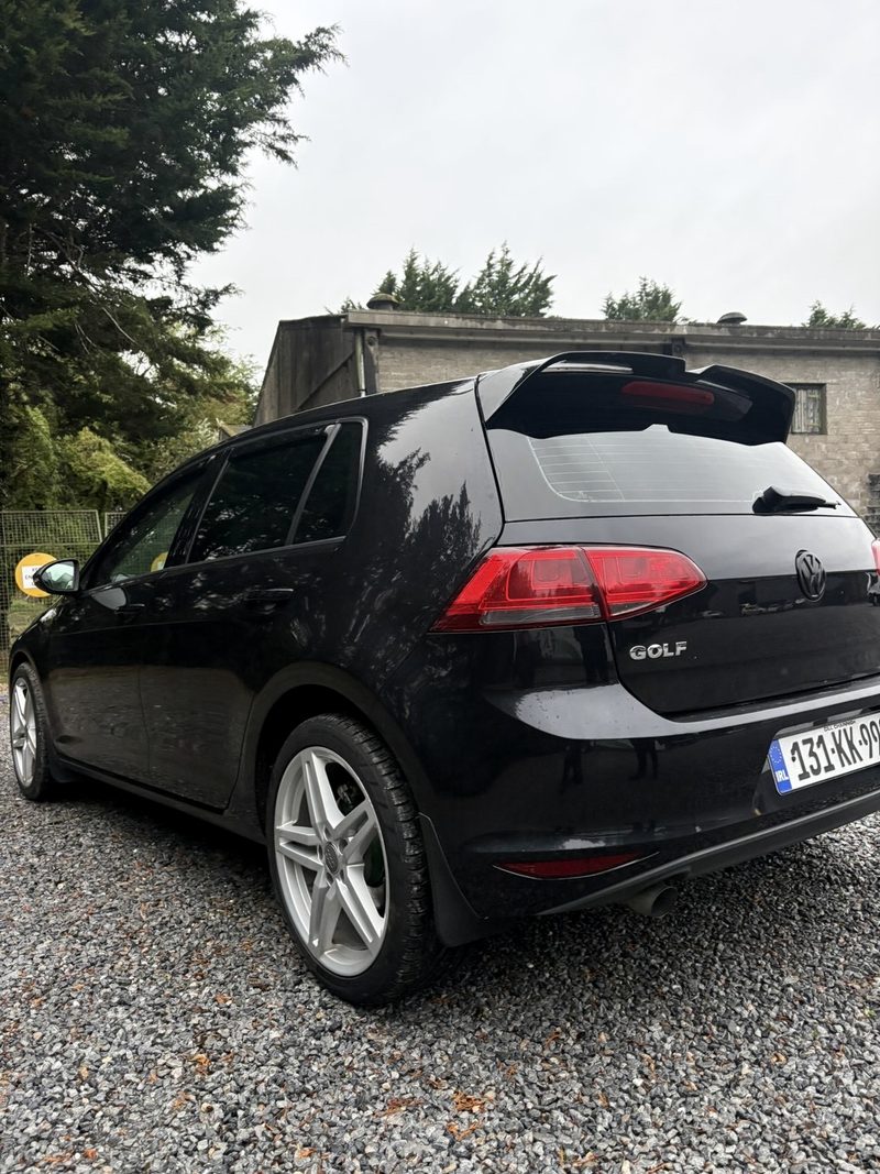 Black VW Golf, rear windows
